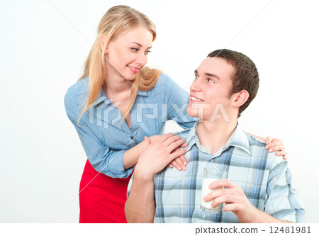 wife gives her husband a meal 12481981