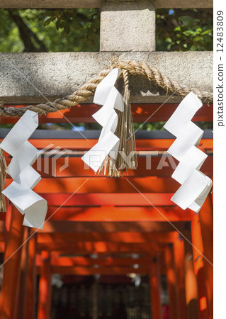 Inari shrine's torii and papers Inari shrine's torii and papers 12483809
