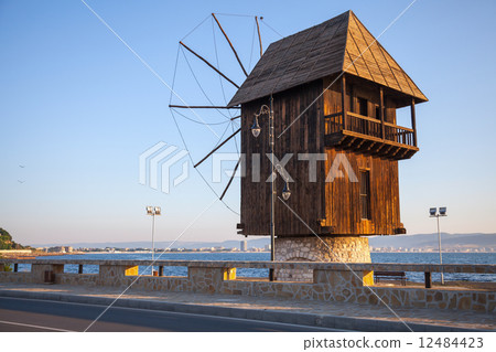 Old wooden windmill on the coast, the most popular landmark of o 12484423