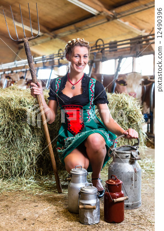Sexy Countrywoman in cowhouse 12490396