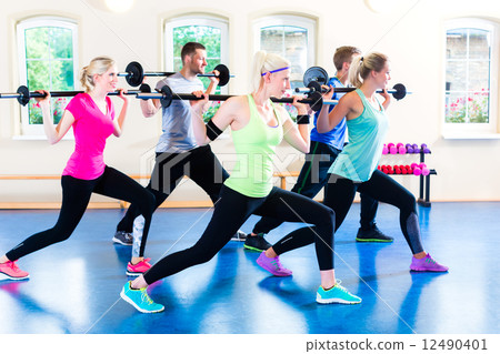 weight training in the gym with dumbbells weight training in the gym with dumbbells 12490401
