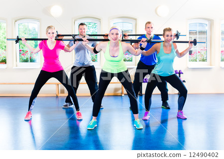 weight training in the gym with dumbbells weight training in the gym with dumbbells 12490402