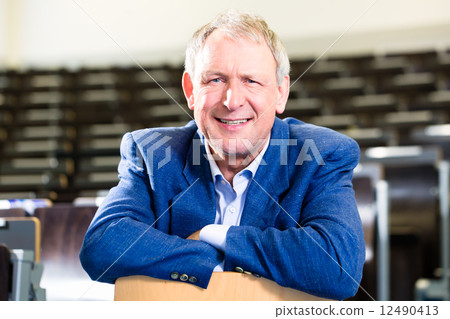 College professor in auditorium College professor in auditorium 12490413