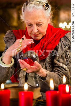 Soothsayer during session with crystal ball 12490437