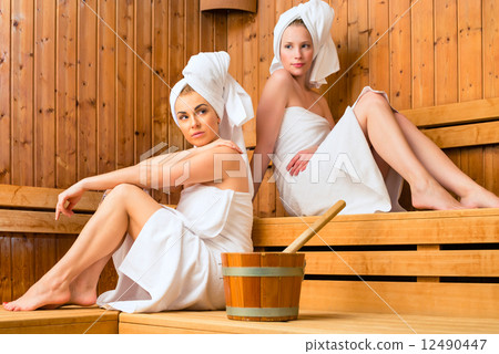 Two women in wellness spa enjoying sauna infusion Two women in wellness spa enjoying sauna infusion 12490447