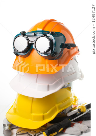 Safety hat and goggles glasses isolated 12497127
