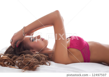 Profile of beautiful model posing in pink bra 12497507