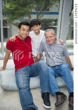 three generation asian men enjoying family bonding time together 12499224