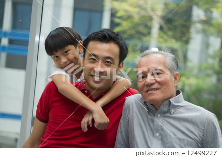 three generation asian men enjoying family bonding time together 12499227