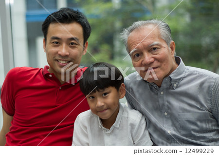 three generation asian men enjoying family bonding time together 12499229