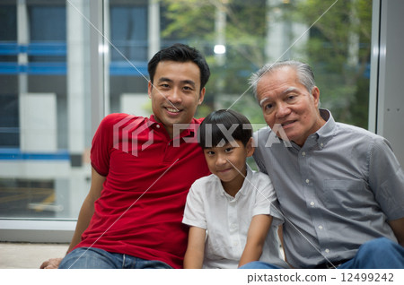 three generation asian men enjoying family bonding time together 12499242