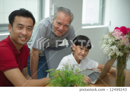 three generation asian men enjoying family bonding time together 12499243