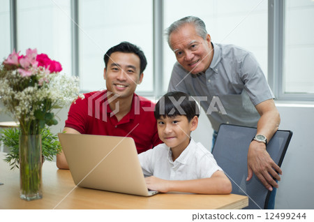 three generation asian men enjoying family bonding time together 12499244