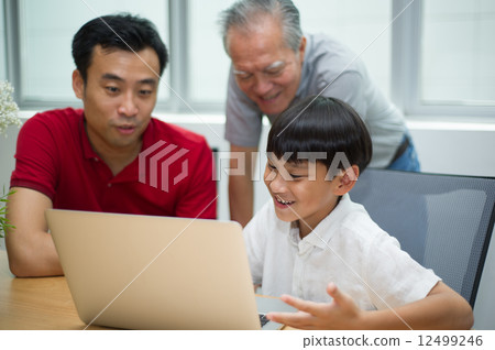 three generation asian men enjoying family bonding time together 12499246