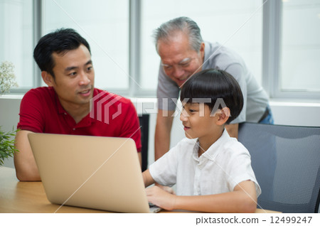three generation asian men enjoying family bonding time together 12499247