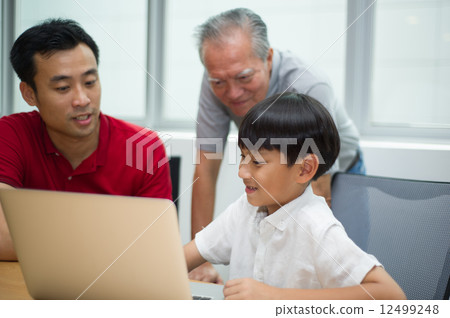three generation asian men enjoying family bonding time together 12499248