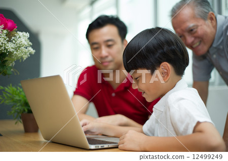 three generation asian men enjoying family bonding time together 12499249