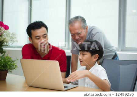 three generation asian men enjoying family bonding time together 12499250