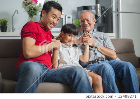 3 generation Asian family enjoying a bonding moment together at home 12499271
