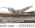newspaper pepper on a stack of newspaper 12504819