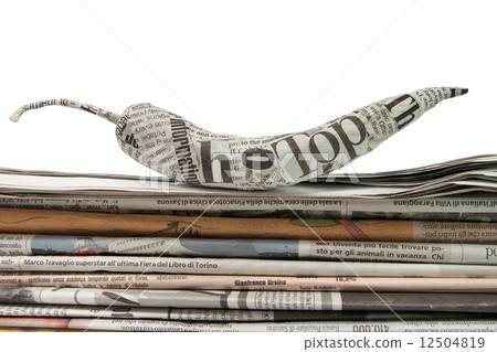 newspaper pepper on a stack of newspaper newspaper pepper on a stack of newspaper 12504819