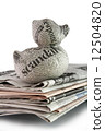 newspaper duck on a stack of newspaper 12504820