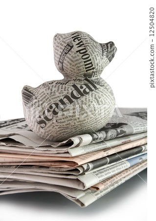 newspaper duck on a stack of newspaper newspaper duck on a stack of newspaper 12504820