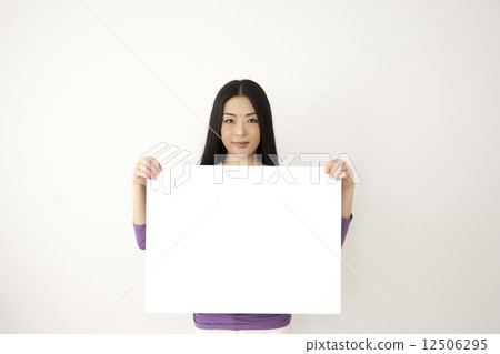 A woman with a message board A woman with a message board 12506295