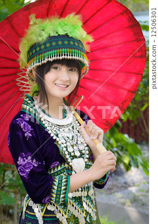 cute asian girl in beautiful hill tribe (HMONG) costume of 12506301