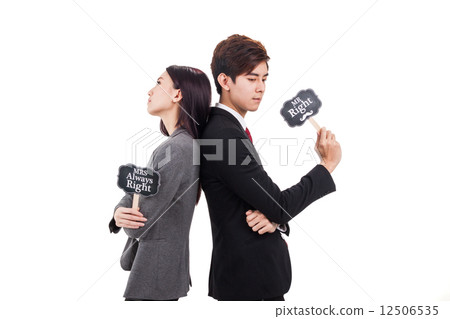 Office couple back to back posing holding placard 12506535