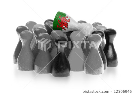 One unique pawn on top of common pawns One unique pawn on top of common pawns 12506946