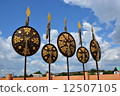 Oriental shields with gilded decoration hanging on decorative spears 12507105
