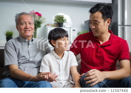 A family of 3 generation of male -Son,father,grandfather- spending time interacting among themselves 12507488