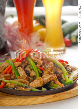 original fajita sizzling hot  on iron plate 12507675