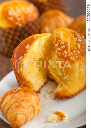 fresh baked muffin and croissant mignon 12509056