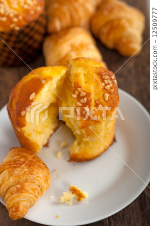 fresh baked muffin and croissant mignon 12509777