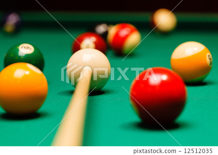 Billiard balls in a pool table. 12512035