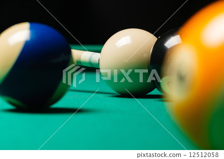 Billiard balls in a pool table. 12512058