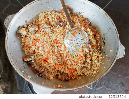 Cooking pilaf dish in outdoor restaurant Cooking pilaf dish in outdoor restaurant 12512524