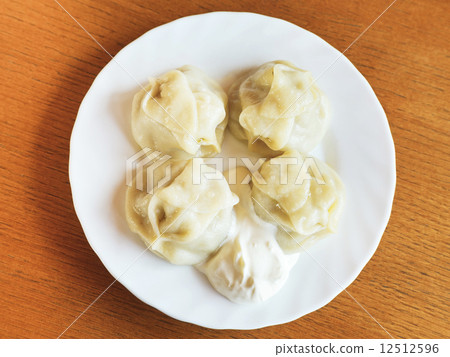 top view of manti dumpling on white plate top view of manti dumpling on white plate 12512596