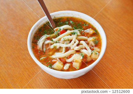 laghman soup in white bowl 12512600