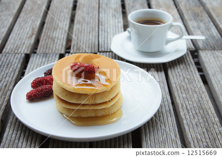 Stack of delicious pancakes with fresh fruits 12515669