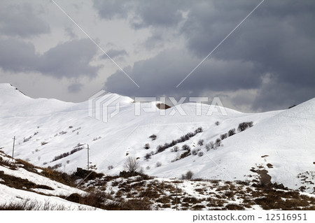 Off-piste slope and overcast sky 12516951