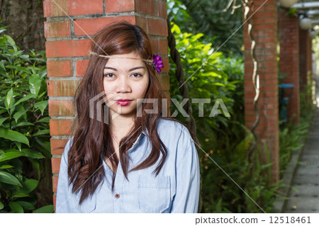 Filipina woman in a garden 12518461