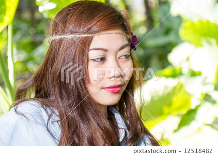 Filipina woman in a garden Filipina woman in a garden 12518482