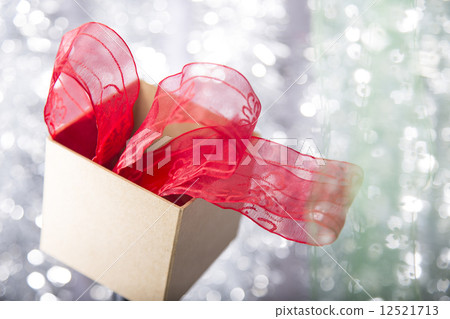 open christmas gift box with red ribbon in it open christmas gift box with red ribbon in it 12521713
