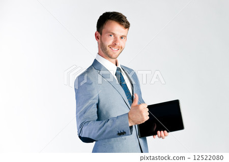 Businessman presenting tablet computer 12522080