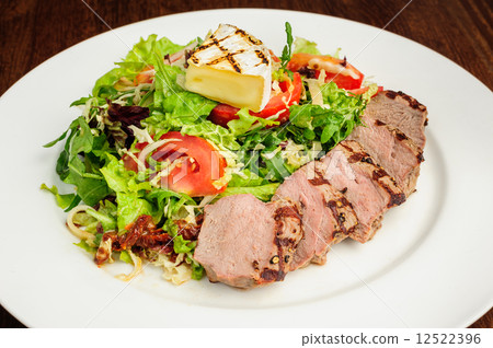 Veal meat with fresh vegetable salad Veal meat with fresh vegetable salad 12522396