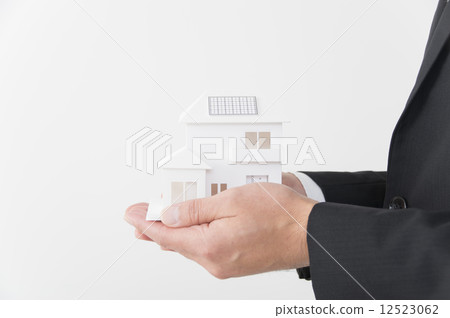 Male hand with comfortable housing model 12523062