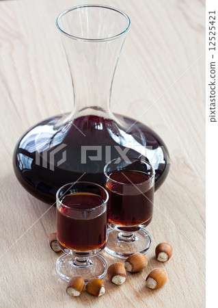 Homemade Hazelnut liqueur in a carafe 12525421
